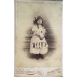 J. C. GARDNER [PHOTOGRAPHER] WYOMING, young girl posing with a banner on dress together with 4