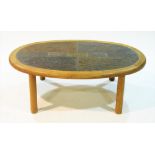 A Haslev stone inset oval coffee table.