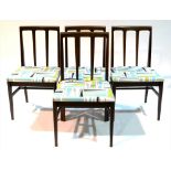 Four Afromosia dining chairs.