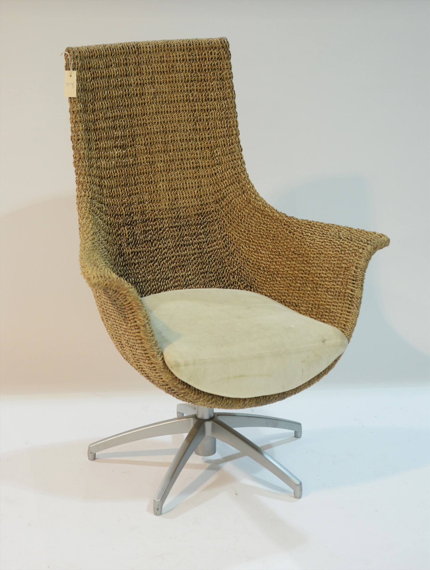 Modern swivel wicker armchair.