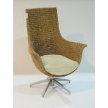 Modern swivel wicker armchair.