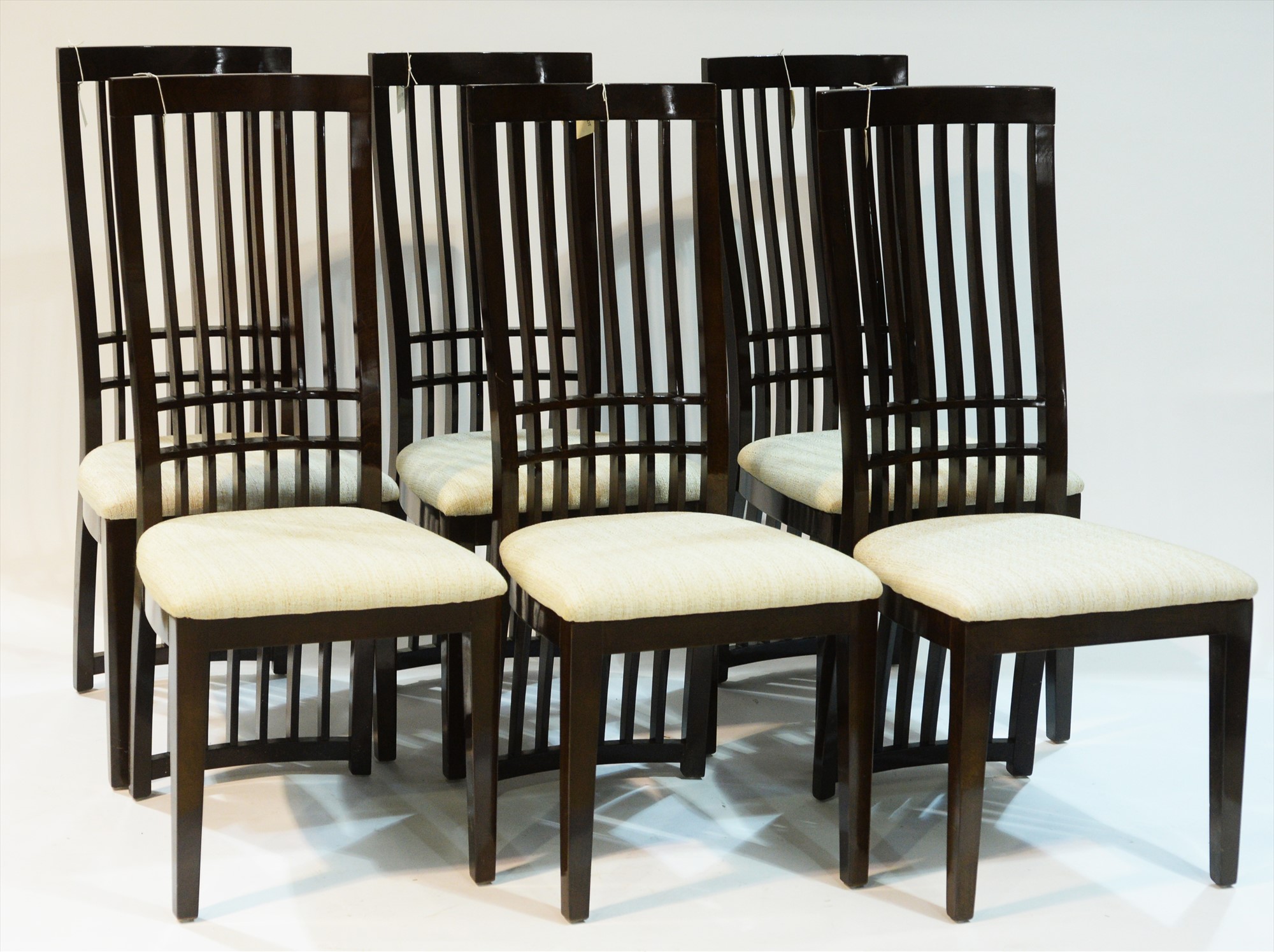 Six dining chairs by Harveys.