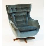 A Mid-20th Century swivel and reclining armchair