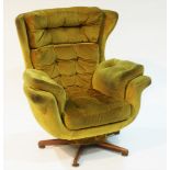 A Mid-20th Century swivel and reclining armchair.