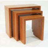 A contemporary nest of three elm occasional tables with black inlaid line-work; largest 60 x 30