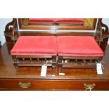 A pair of early 20th Century stained wood rectangular footstools with red upholstery, each 29 x