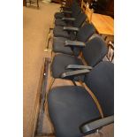 Set of ten elbow chairs.