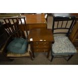 An early 20th century oak side table and two chairs