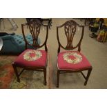 Four 20th century Hepplewhite style dining chairs