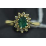 Emerald and diamond cluster ring