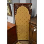 An early 20th century mahogany cane three fold dressing screen, the mahogany frame enclosing