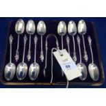 Silver apostle teaspoons and tongs