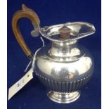 A silver water jug