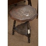 A late Victorian oak stool, the octagonal top carved with vines and flower boarder and raised on