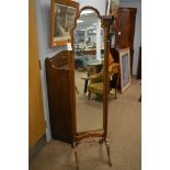 An Edwardian mahogany cheval mirror