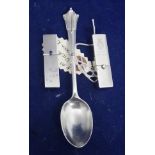 Silver spoon and metal lipstick holder