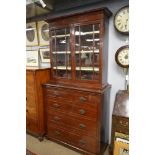 An Edwardian chest of drawers with associated top