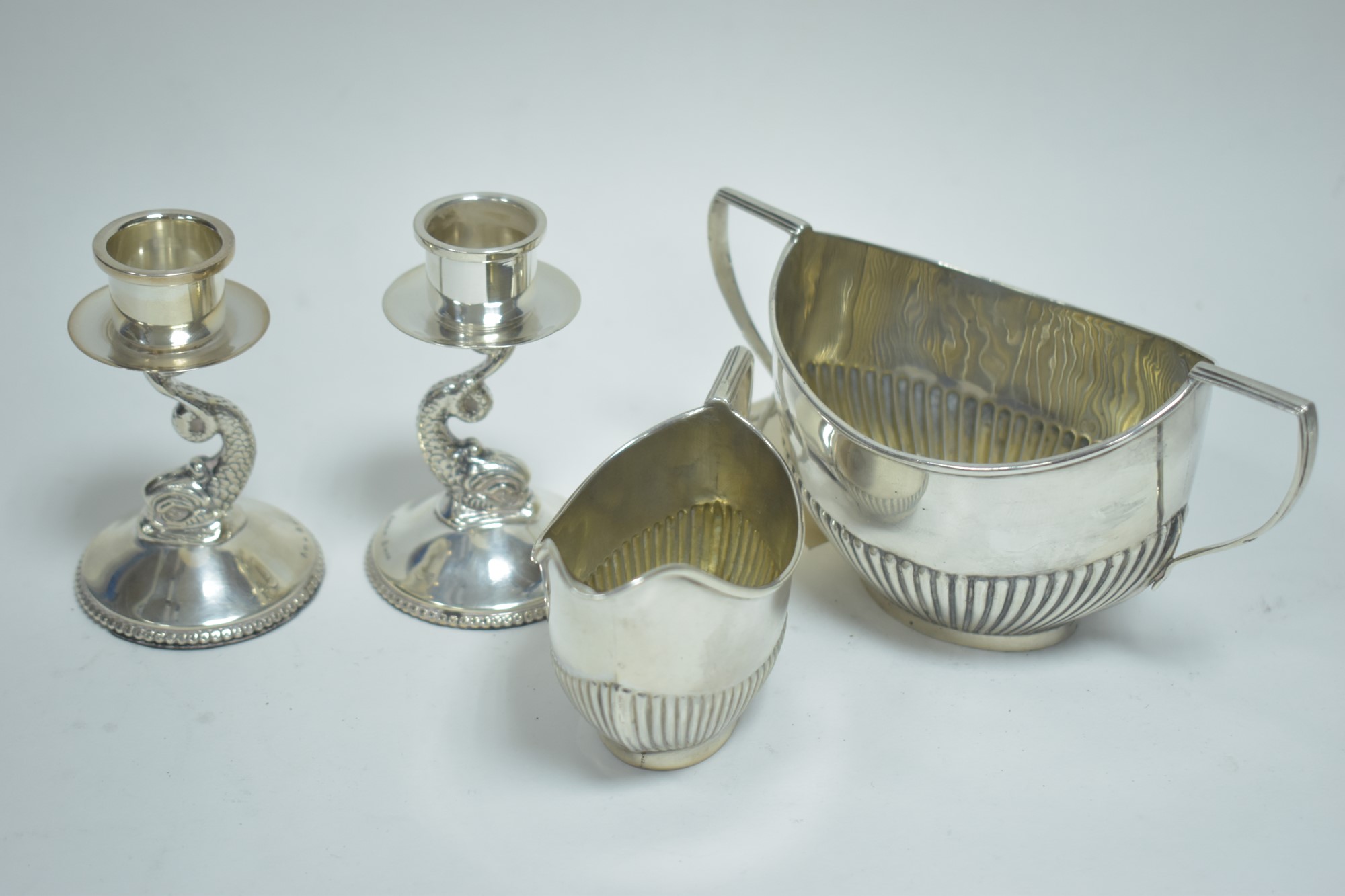 Silver jug, sugar bowl and candle sticks