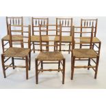 A mixed group of seven elm dining chairs