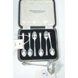Silver teaspoons and sugar sifter
