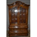 A Heritage spalted and figured elm Dutch style display cabinet on chest, the upper section with