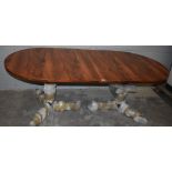 Brazilian rosewood twin pedestal dining table.