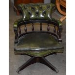 Withdrawn: Green leather office chair.