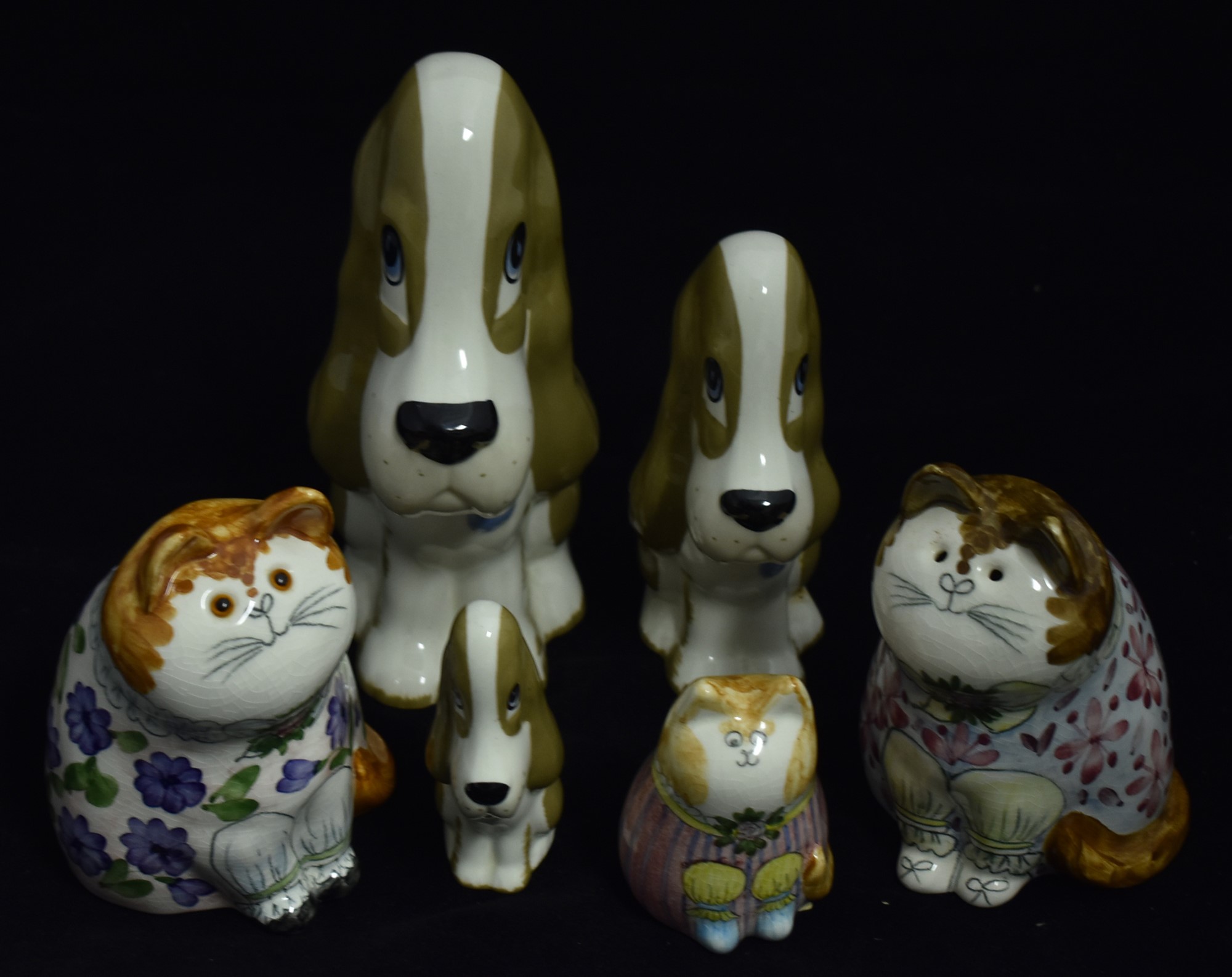 Three Studio pottery cats; and three ceramic figures.