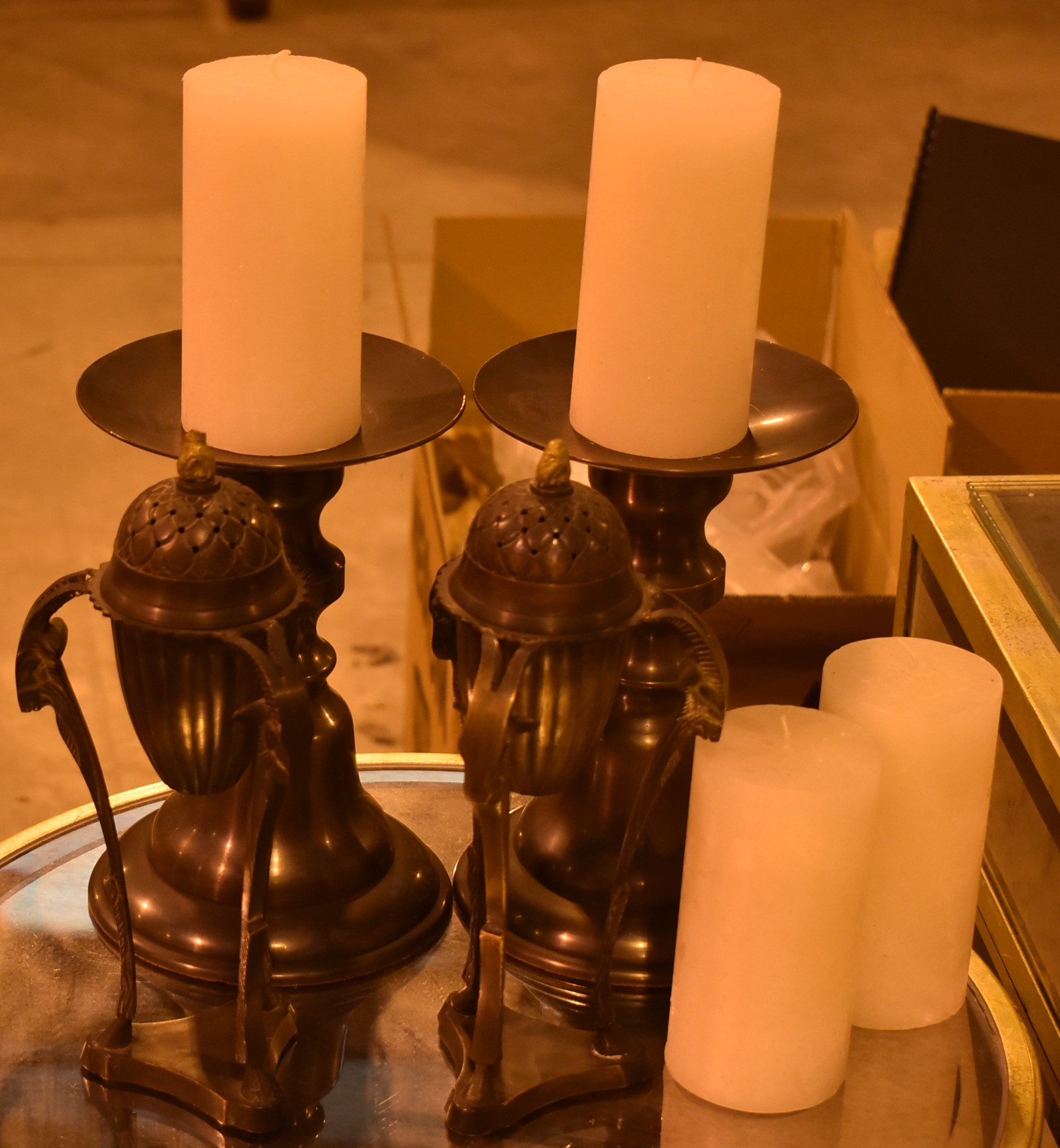 Pair of prickett candlesticks; and pair of bronzed metal supports.