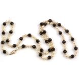 Onyx and cultured pearl necklace