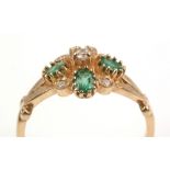 Emerald and diamond cluster ring