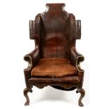 Queen Anne style wingback armchair.