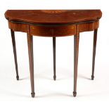 An Edwardian fiddle-back mahogany and inlaid serpentine card table