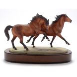 Royal Worcester figure galloping ponies