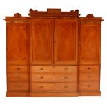 An early 20th century mahogany breakfront wardrobe