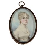 British School - a miniature portrait of a young woman wearing an empire-line dress,
