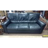 Black three-seater sofa.