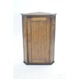 A George III oak corner cupboard