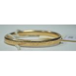 Yellow metal bangle