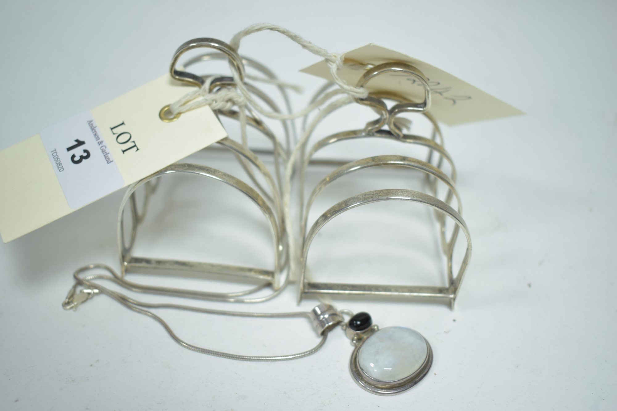 Pair silver toast racks and a necklace