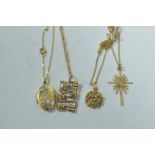 Four gold pendants on chains