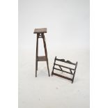 An early 20th Century oak plant stand, with square top and outswept square legs united by an