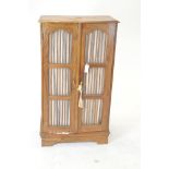 Spindle door cabinet