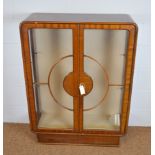 A mid 20th Century Art Deco style afrormosia display cabinet