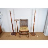 A 1920's Jacobean chair; two stained beech standard lamps, and a yew wood torchere (4)
