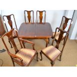 Georgian style mahogany extending dining table; and dining chairs.