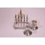 Silver toast rack and pair of miniature candlesticks