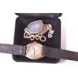 Ola Gorie pendant and Rone wristwatch