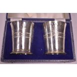 A pair of silver beakers for Queen Elizabeth II Silver Jubilee