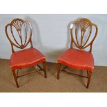 A pair of 19th Century oak shield back dining chairs